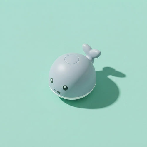 Ballena luminosa de baño encendida con luz LED en el agua
